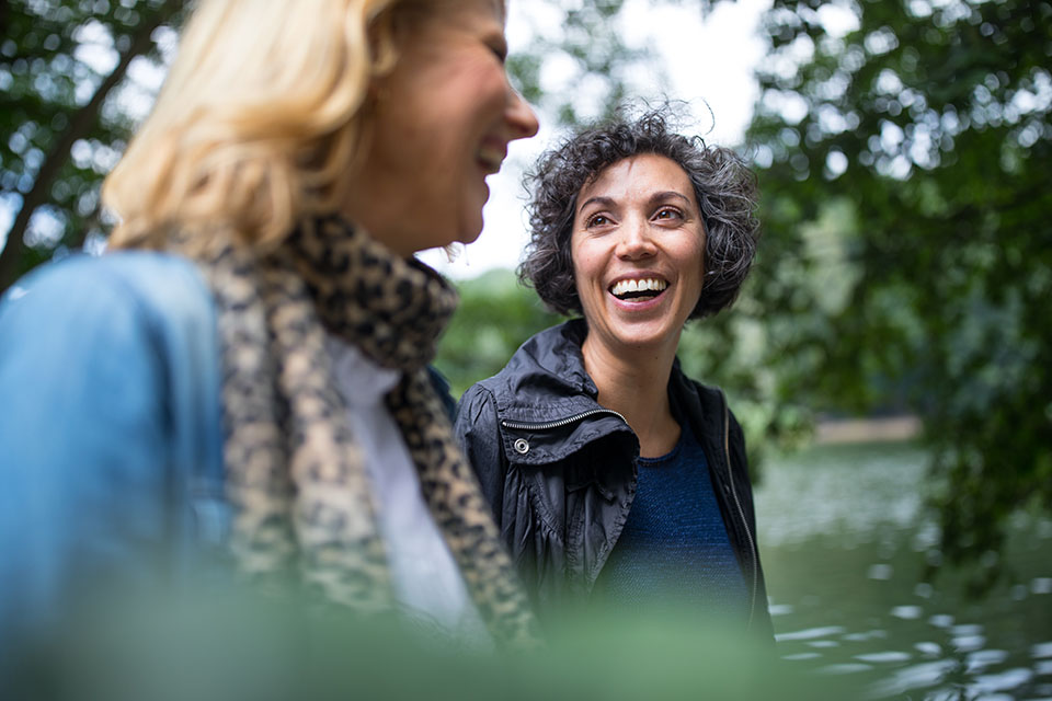 two-females-walking in a park