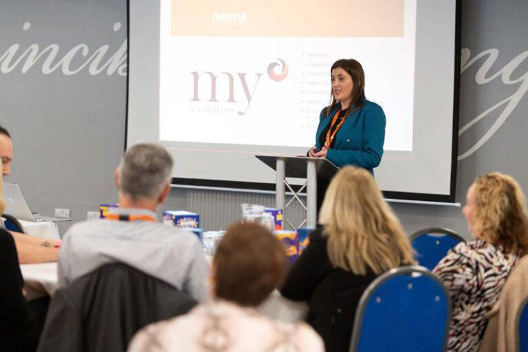 Joanne speaking in front of staff