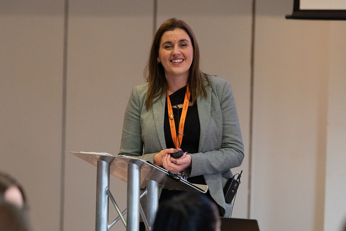 Joanne speaking at a conference