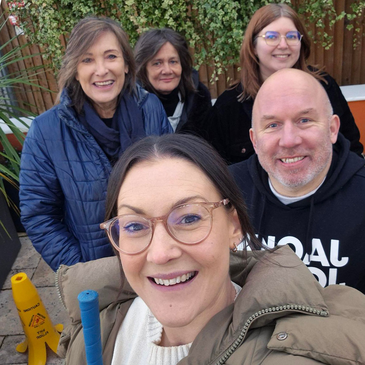 Group of people smiling to a camera